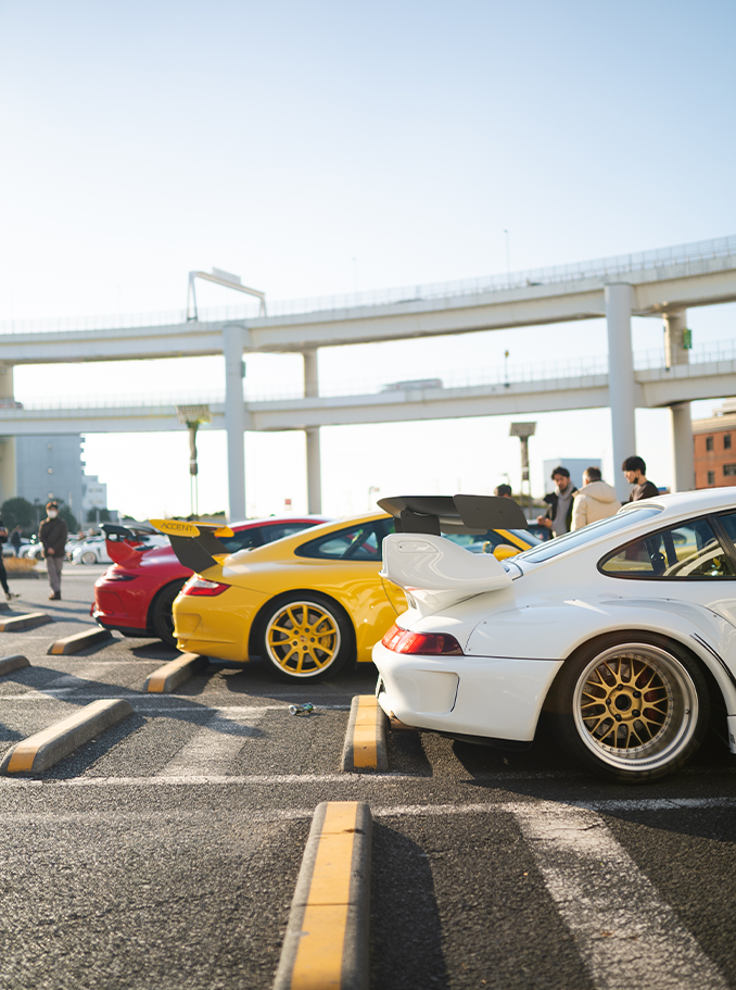 Red, Yellow, White Porsches at Daikoku